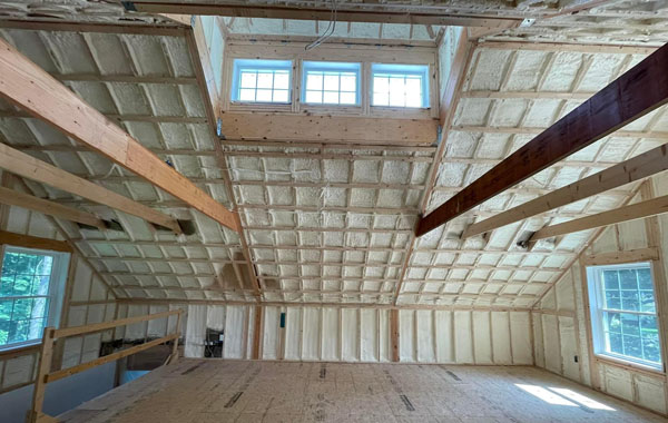 Our Spray Foam Installers applying 5 inches of closed cell spray foam insulation in a great room. Worcester Massachusetts